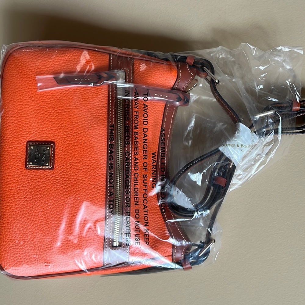 Brand new Dooney & Burke satchel color clementine/ orange
